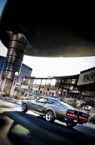 Vintage Ford Mustang GT muscle car driving down Las Vegas Strip, Fashion Show Mall, roller shot Las Vegas - Automotive Photography by Radiant Photography for PR, Advertising and Editorial Photography.